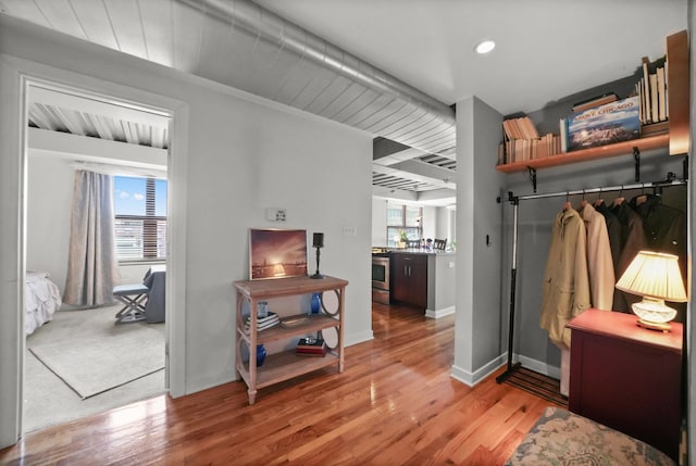 interior space featuring light wood finished floors, baseboards, and recessed lighting