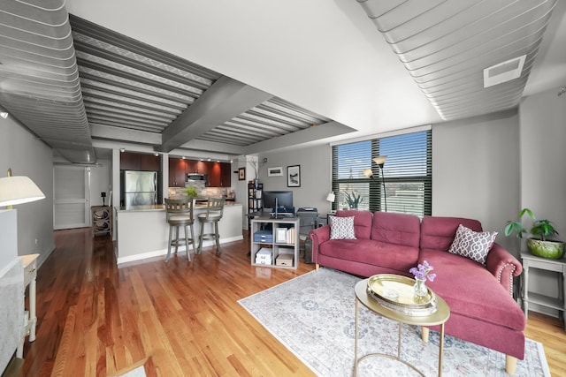 living room featuring light wood-type flooring