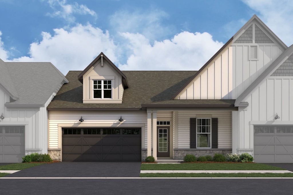 25503 W Stockwell Dr, Plainfield, IL 60544 - view of front of property with stone siding, board and batten siding, an attached garage, and a shingled roof