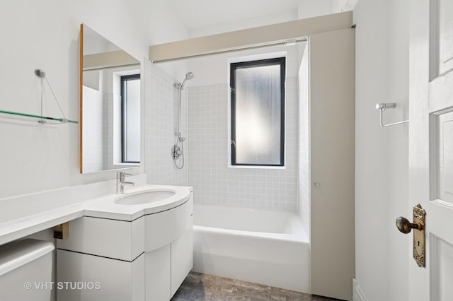 bathroom featuring plenty of natural light, shower / washtub combination, vanity, and toilet