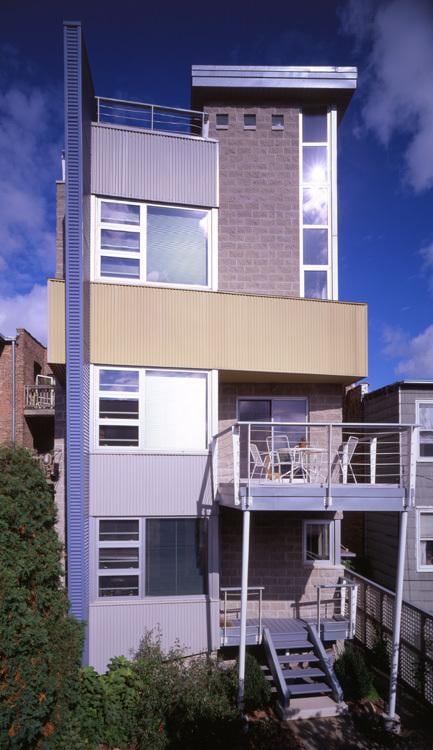 back of property with a balcony