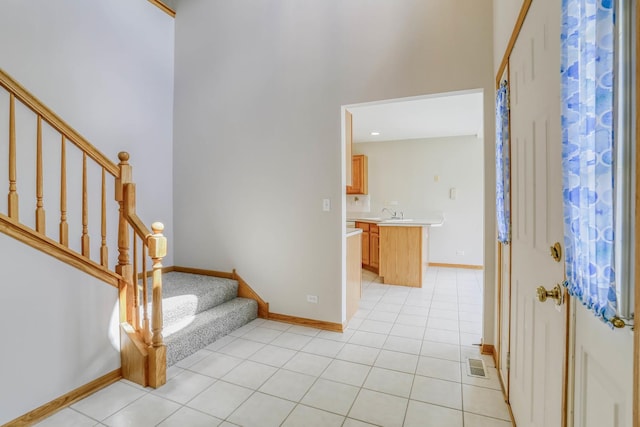 13860 Steeples Rd, Lemont, IL 60439 - entryway with stairway, baseboards, and light tile patterned floors