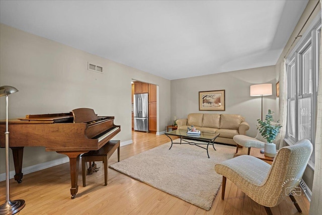 585 Apache Dr, Batavia, IL 60510 - living area with light wood-style flooring and baseboards