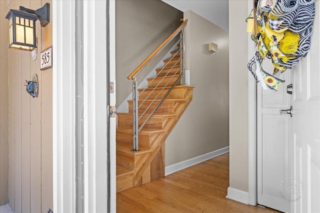 585 Apache Dr, Batavia, IL 60510 - staircase featuring wood finished floors and baseboards