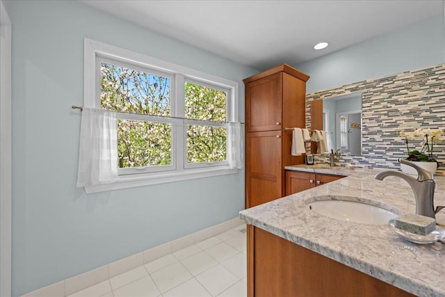 585 Apache Dr, Batavia, IL 60510 - full bath with decorative backsplash, double vanity, and baseboards