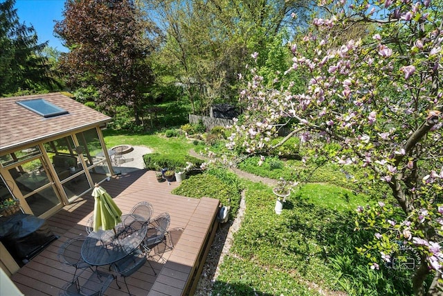 585 Apache Dr, Batavia, IL 60510 - wooden terrace featuring outdoor dining area and a fire pit