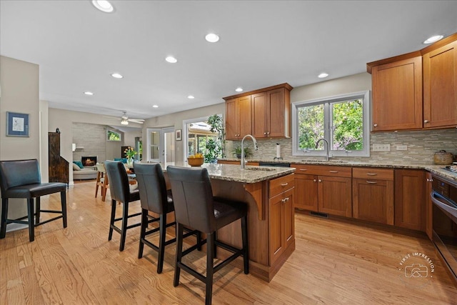 585 Apache Dr, Batavia, IL 60510 - kitchen with a sink, healthy amount of natural light, light wood-type flooring, and recessed lighting
