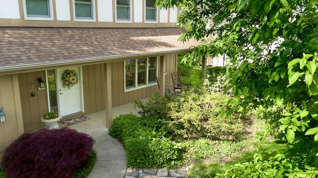 585 Apache Dr, Batavia, IL 60510 - entrance to property featuring board and batten siding and a shingled roof