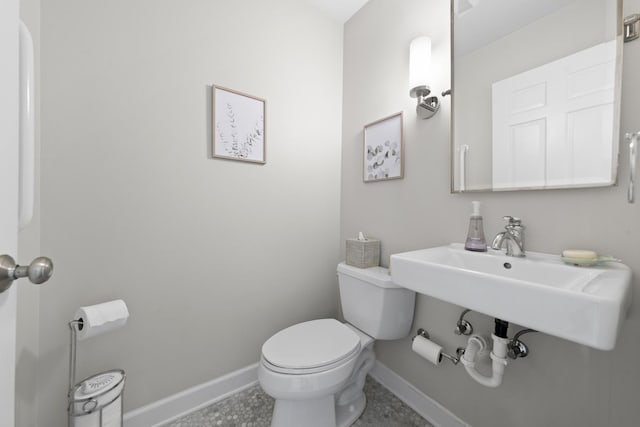 1557 Swallow St, Naperville, IL 60565 - half bathroom featuring baseboards, toilet, and a sink