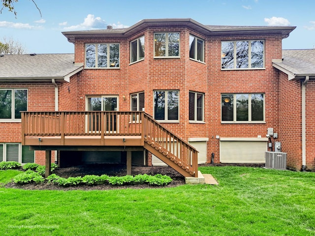 back of house featuring brick siding, a yard, a deck, central air condition unit, and stairway