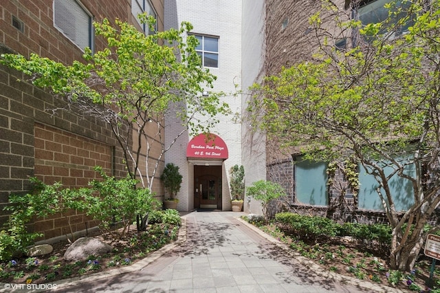 entrance to property with brick siding