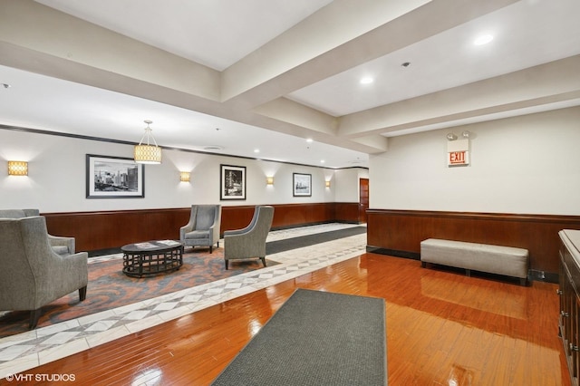 common area featuring a wainscoted wall, recessed lighting, and wooden walls