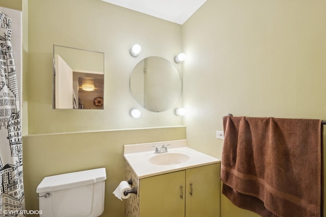 full bath with toilet and vanity