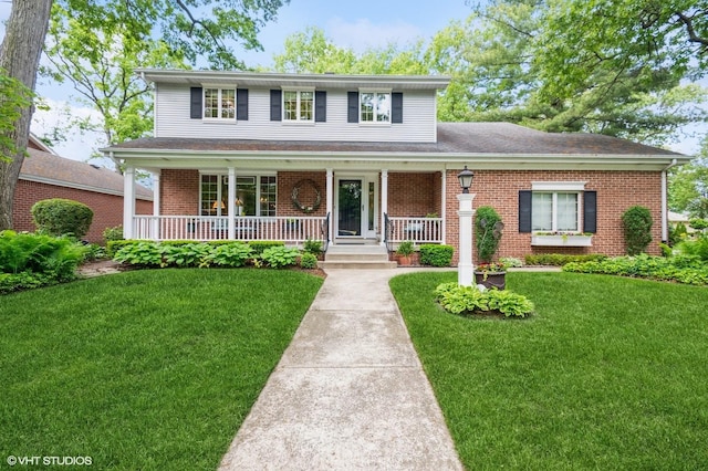 18038 Whitman Ln, Lansing, IL 60438 - traditional-style house with covered porch, brick siding, and a front yard