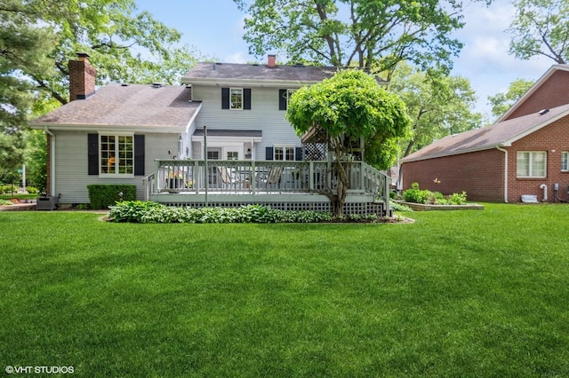 18038 Whitman Ln, Lansing, IL 60438 - back of property featuring a chimney, a deck, and a yard