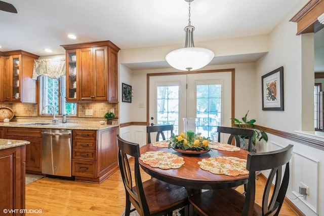 18038 Whitman Ln, Lansing, IL 60438 - kitchen with dishwasher, brown cabinetry, healthy amount of natural light, backsplash, and recessed lighting