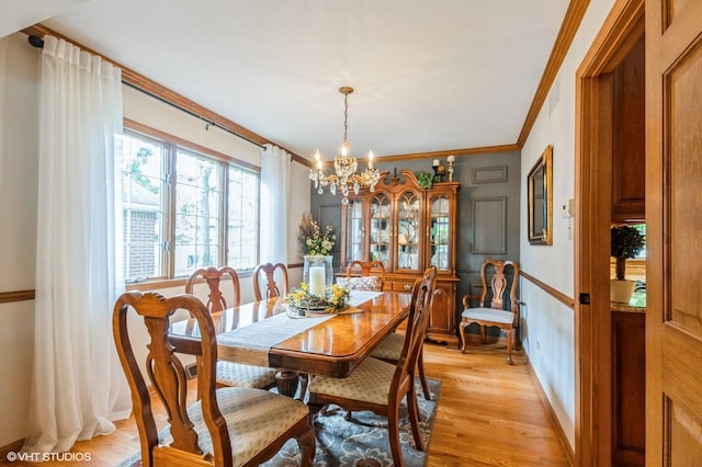 18038 Whitman Ln, Lansing, IL 60438 - dining room with a chandelier, ornamental molding, and light wood-style floors