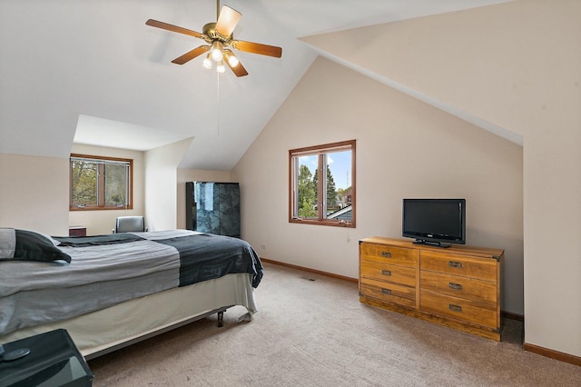 bedroom with multiple windows, carpet flooring, baseboards, and vaulted ceiling