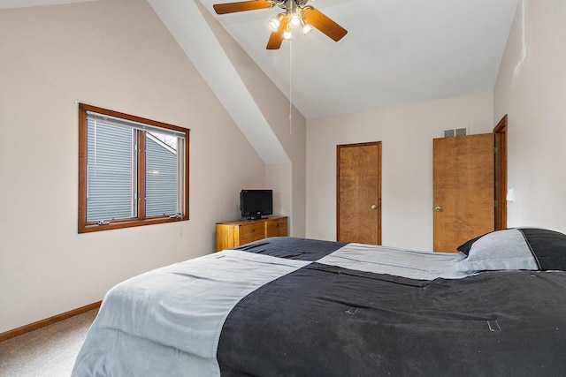 carpeted bedroom featuring baseboards, vaulted ceiling, and ceiling fan