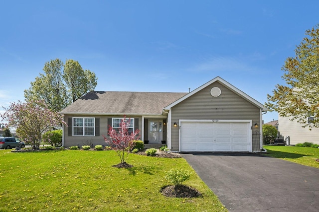 10409 Evendale Dr, Huntley, IL 60142 - view of front facade with an attached garage, asphalt driveway, a front yard, and a shingled roof