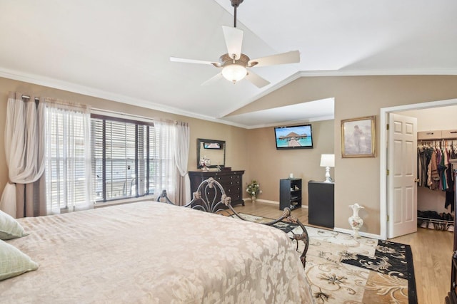 10409 Evendale Dr, Huntley, IL 60142 - bedroom featuring wood finished floors, baseboards, vaulted ceiling, crown molding, and a spacious closet