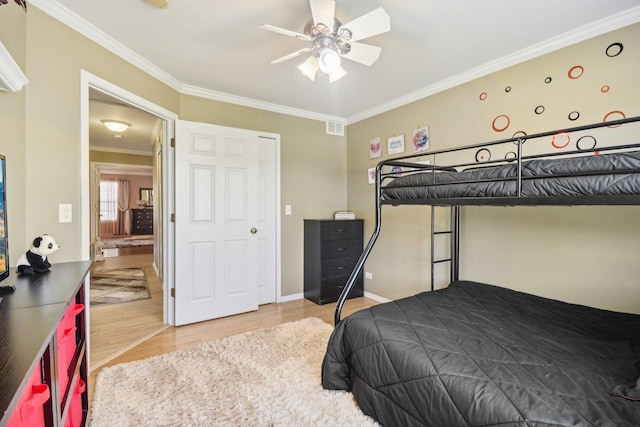 10409 Evendale Dr, Huntley, IL 60142 - bedroom featuring wood finished floors, ornamental molding, baseboards, and a ceiling fan