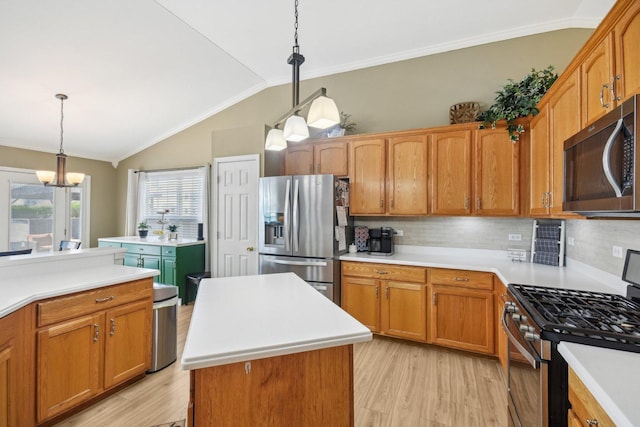 10409 Evendale Dr, Huntley, IL 60142 - kitchen featuring appliances with stainless steel finishes, light wood-style floors, a chandelier, decorative backsplash, and lofted ceiling