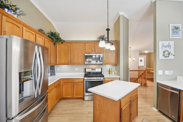 10409 Evendale Dr, Huntley, IL 60142 - kitchen with appliances with stainless steel finishes, light wood finished floors, light countertops, a chandelier, and crown molding