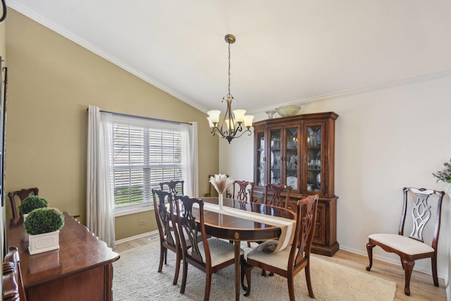 10409 Evendale Dr, Huntley, IL 60142 - dining room with a chandelier, light wood-type flooring, ornamental molding, baseboards, and lofted ceiling