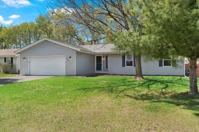 ranch-style home featuring a front lawn, driveway, and a garage