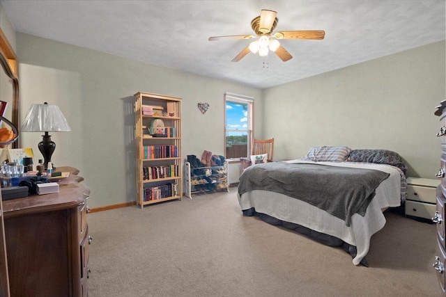bedroom featuring carpet flooring, baseboards, and a ceiling fan
