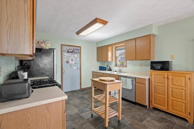 kitchen with freestanding refrigerator, black microwave, light countertops, and dishwasher