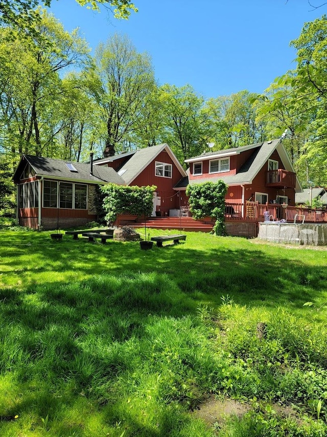 6N241 Roselle Rd, Roselle, IL 60172 - rear view of house with a wooden deck and a yard