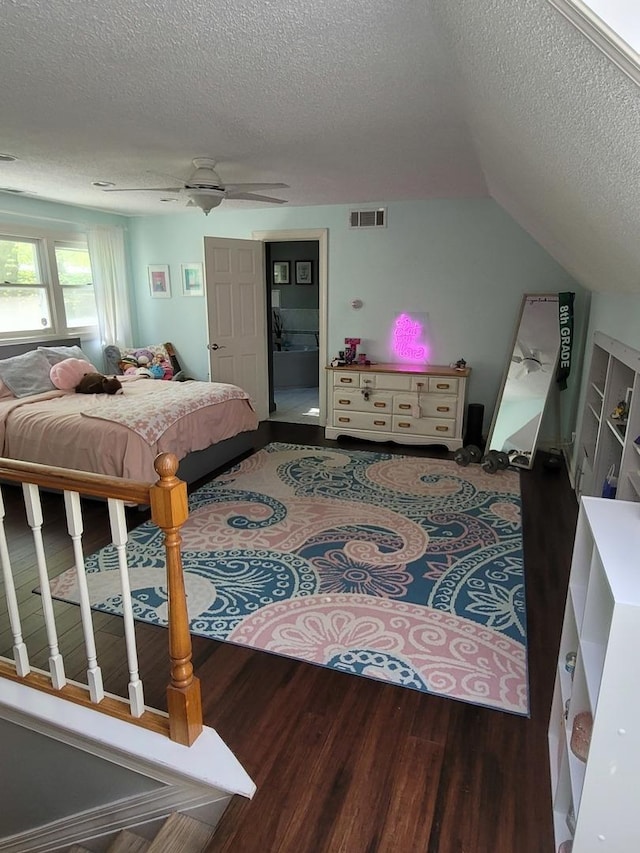 6N241 Roselle Rd, Roselle, IL 60172 - bedroom with a textured ceiling, wood finished floors, a ceiling fan, ensuite bathroom, and vaulted ceiling