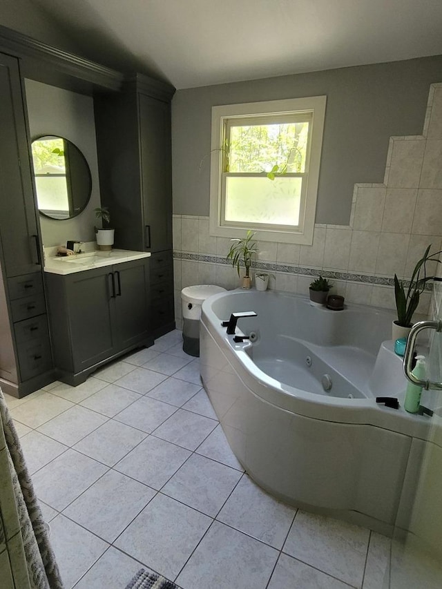 6N241 Roselle Rd, Roselle, IL 60172 - full bathroom with healthy amount of natural light, tile patterned floors, tile walls, a whirlpool tub, and vanity