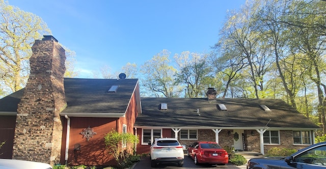6N241 Roselle Rd, Roselle, IL 60172 - view of side of home with a chimney and roof with shingles