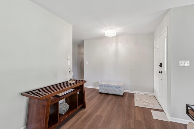 entryway featuring wood finished floors and baseboards