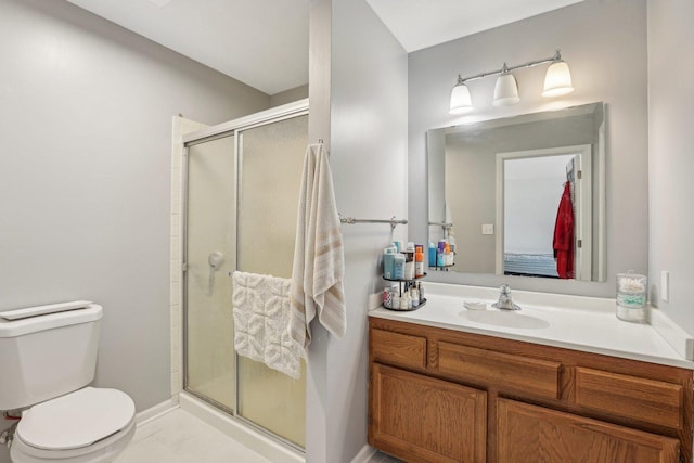 bathroom with toilet, a stall shower, vanity, baseboards, and marble look tiles