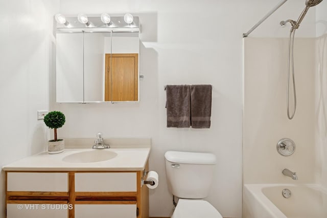 1443 Spring Brook Ct Unit 1B, Round Lake Beach, IL 60073 - bathroom featuring vanity, toilet, and bathing tub / shower combination