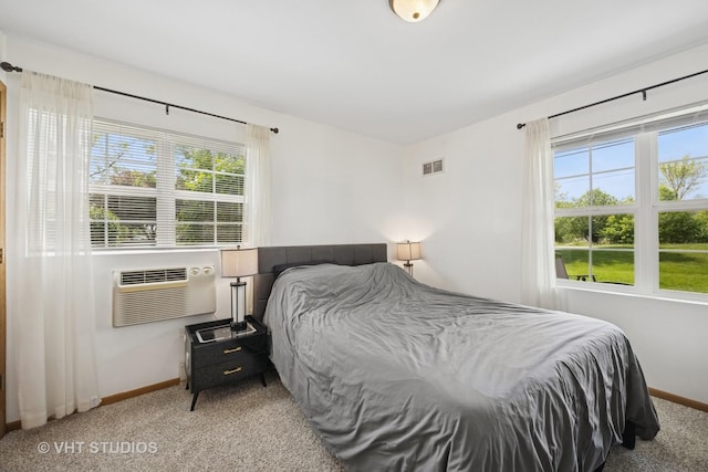1443 Spring Brook Ct Unit 1B, Round Lake Beach, IL 60073 - bedroom featuring baseboards, light colored carpet, and cooling unit