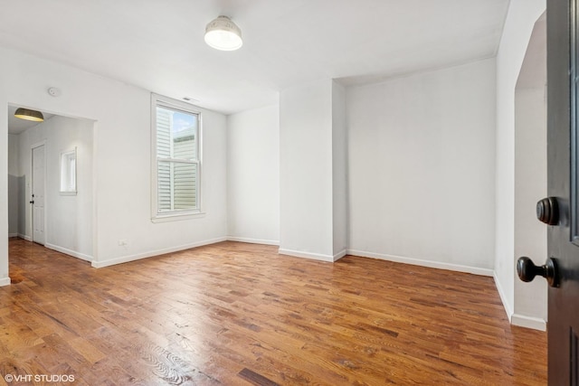 1751 W 21st Pl, Chicago, IL 60608 - unfurnished room featuring wood finished floors and baseboards