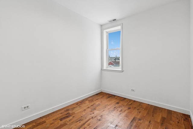 1751 W 21st Pl, Chicago, IL 60608 - unfurnished room featuring baseboards and wood finished floors