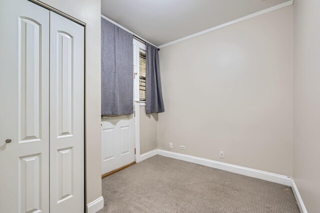 2241 N Lincoln Ave Unit 1A, Chicago, IL 60614 - unfurnished bedroom with carpet, ornamental molding, and baseboards