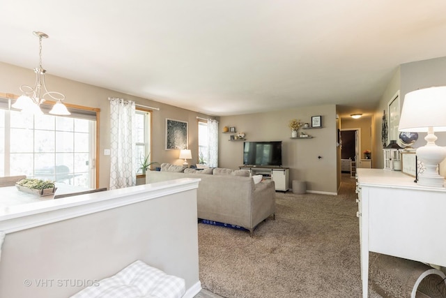1222 Hillsborough Ct Unit 1222, Crystal Lake, IL 60014 - living room with light carpet, a chandelier, and baseboards