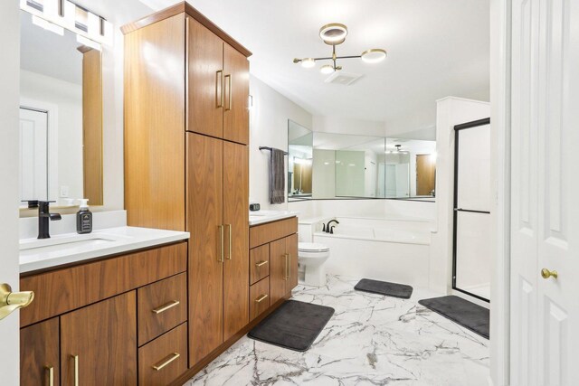 316 Spring Creek Cir, Schaumburg, IL 60173 - bathroom with marble look tiles, a shower stall, two vanities, and a bath