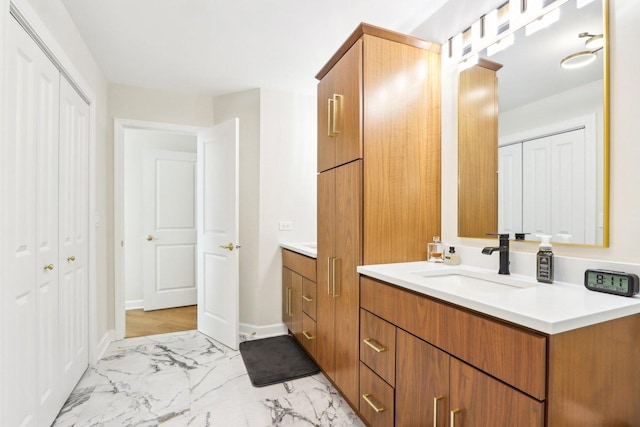 316 Spring Creek Cir, Schaumburg, IL 60173 - bathroom featuring marble finish flooring, vanity, and baseboards