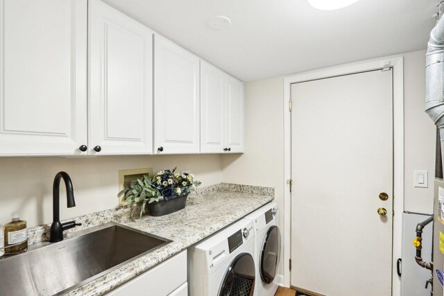 316 Spring Creek Cir, Schaumburg, IL 60173 - clothes washing area with washer and clothes dryer and cabinet space