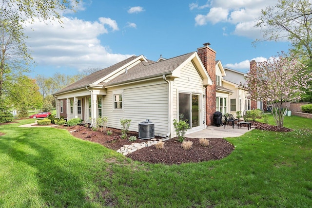 316 Spring Creek Cir, Schaumburg, IL 60173 - view of home's exterior with central AC, a patio, a lawn, and roof with shingles