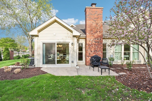 316 Spring Creek Cir, Schaumburg, IL 60173 - rear view of house with a chimney, a lawn, a patio area, and cooling unit