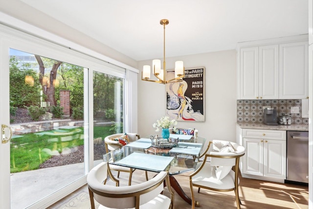 316 Spring Creek Cir, Schaumburg, IL 60173 - dining area with a chandelier and light wood-style floors